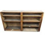 A two section oak open bookcase with moulded pilasters and adjustable shelves. (70.5in x 12.75in x