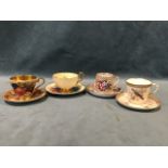 Four cabinet cups & saucers - signed Aynsley fruit, Worcester with birds and enamelled beading,