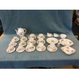 A Royal Crown Derby teaset in the "Derby posies" pattern with cups, saucers and plates, a coffee