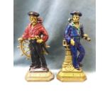 A pair of Victorian marine brass flatbacks, the sailors on stepped plinths titled Britains Pride,