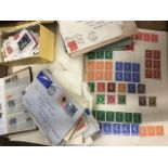 A schoolboy stamp collection contained in two albums, envelopes of loose stamps sorted by countries,