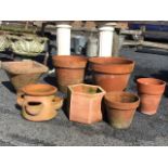 A quantity of miscellaneous terracotta garden flower pots - hexagonal, tapering traditional,