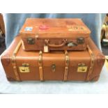 A school trunk with brass mounts having rounded battens and leather corner mounts, the ends with