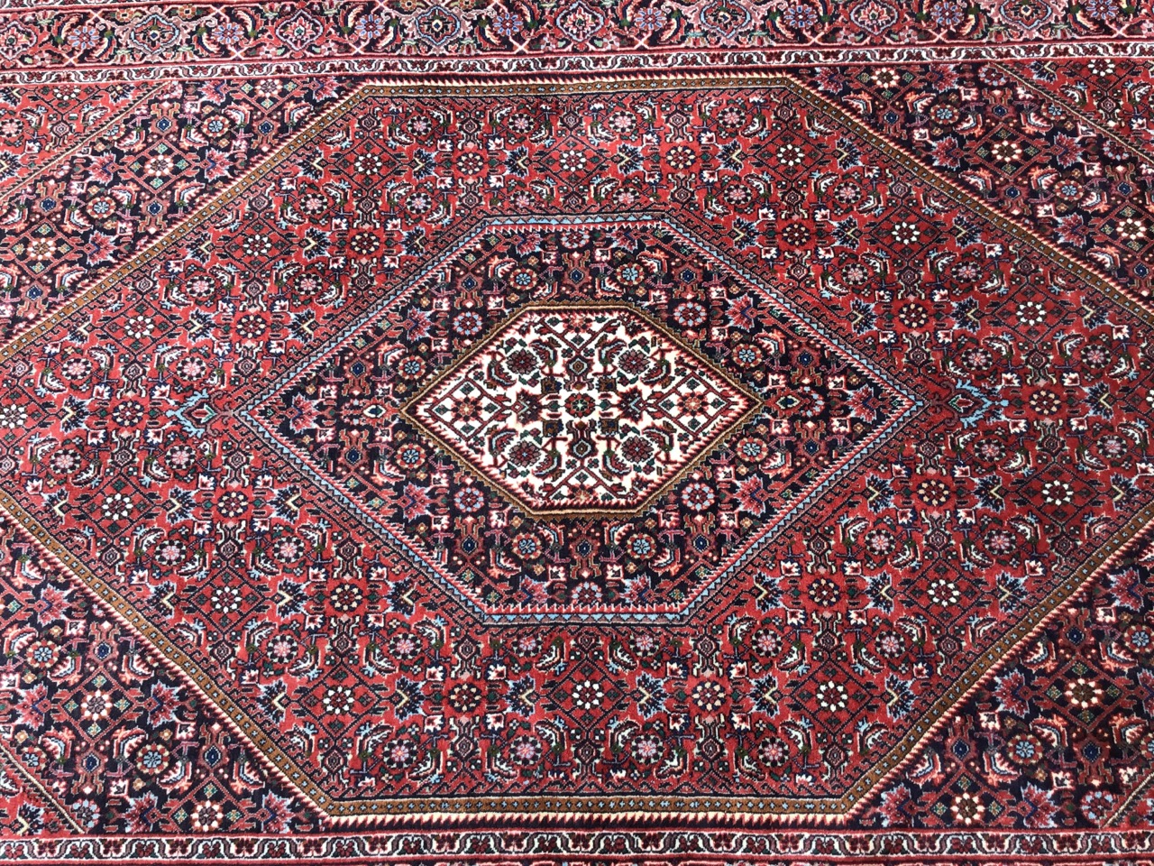 A Kashan style rug woven with multi-floral field centering on a diamond shaped medallion, the frieze - Image 3 of 3