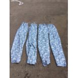 Set of four lined blue and white printed curtains, with flowers and birds. (87in) (4)