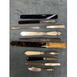 Ten letter openers in various materials including six with silver mounts, tortoiseshell with