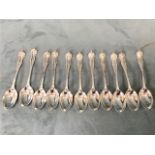 A set of eleven hallmarked silver teaspoons by Maxfield & Sons, the spoons with gadrooned borders