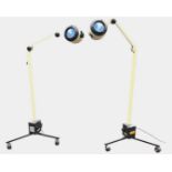 A pair of Daray contemporary spotlights with adjustable arms on stands with castors. (2)