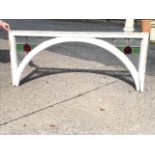 A painted moulded arched frame with leaded stained glass spandrels. (46in x 20in)