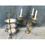 A three-branch gilt metal and cut glass empire style candelabra with scrolled branches; and an