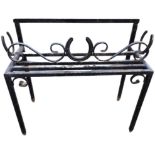 A painted wrought iron plantstand, the rectangular ribbed platform mounted with scrolls and