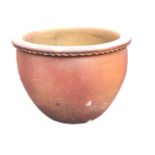 A large stoneware salt glazed palm pot with cushion moulded rim above rippled band and bulbous