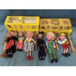 Four boxed Pelham Puppets with handpainted faces - Hansel, Pinocchio, a witch, and a sailor; and two