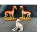 A Meissen porcelain blanc de chine greyhound seated on his haunches - crossed swords marks & numbers