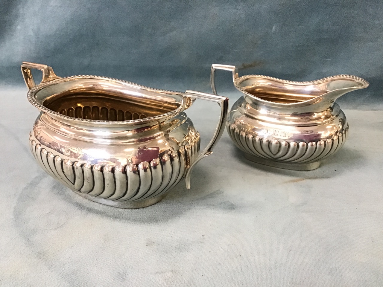 A Victorian three-piece hallmarked silver teaset with oval bulbous gadrooned bodies and angled - Image 2 of 3