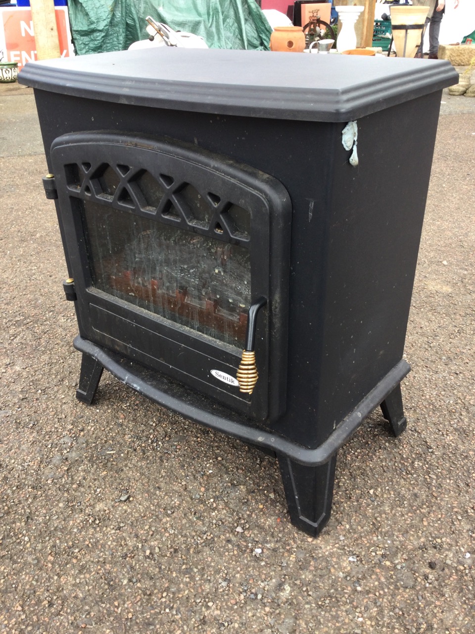 A stove type electric heater with bowfronted moulded top above an arched glazed door enclosing - Image 3 of 3