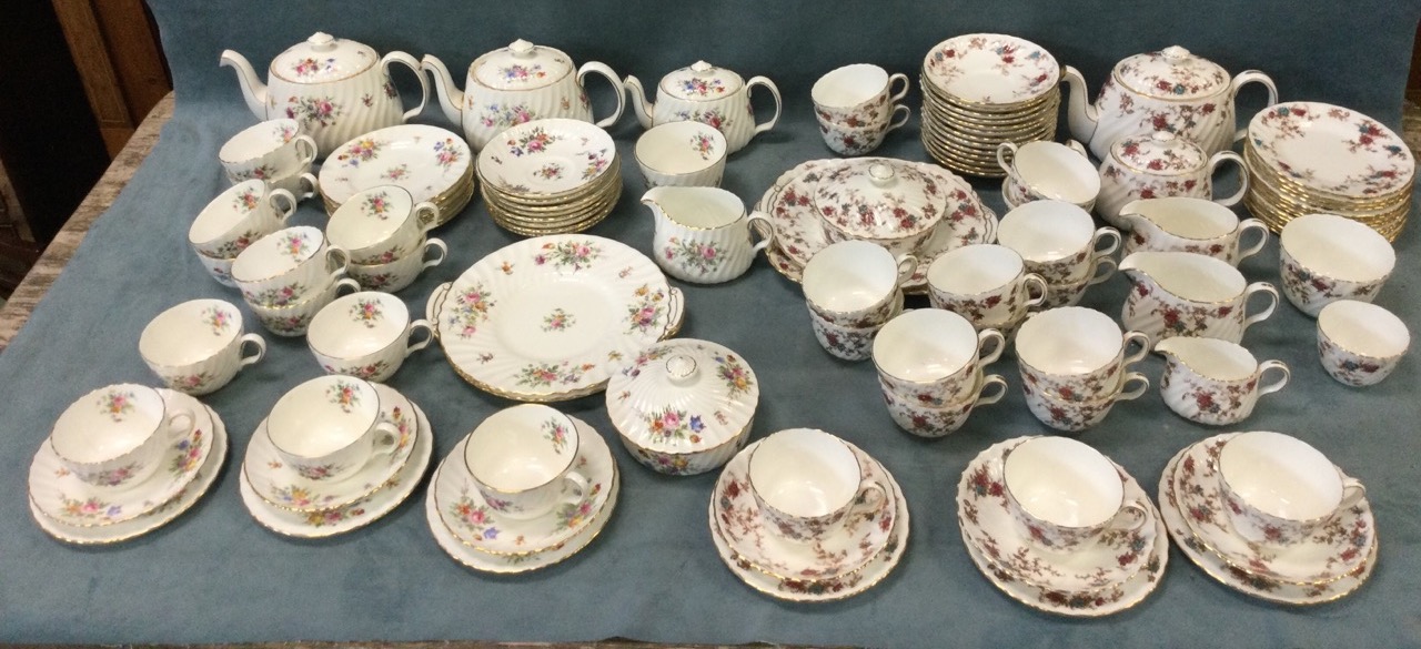 A Minton tea service, decorated in the Ancestral pattern, having two teapots, cups, saucers, milk