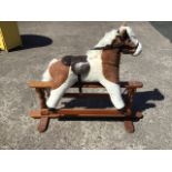 A modern Mulholland & Bailie plush skewbald rocking horse on stand, with saddle and harness (35in