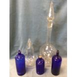 A group of C19th chemists jars and bottles - a tall globular clear glass bottle with wide base and