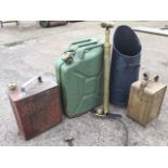 Three fuel cans - Shell, Jerry & Esso Blue; a tapering tubular coal scuttle; and a brass Sphinx