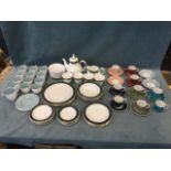 A Susie Cooper white & blue scalloped part tea service with a jug, cups & saucers, together with a