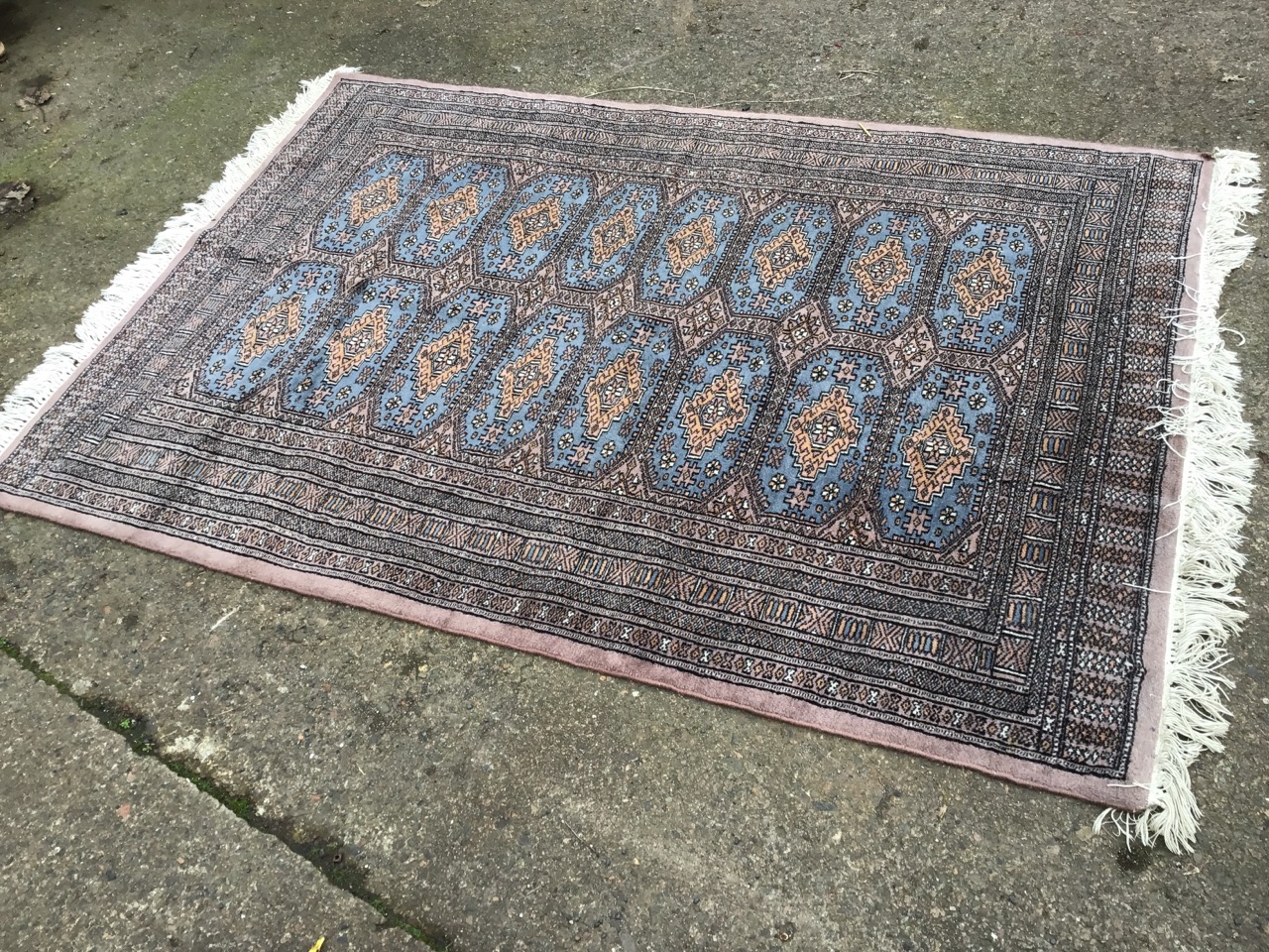 An eastern rug woven with field of sixteen blue panels on grey ground, framed by multiple - Image 2 of 3