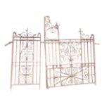 A nineteenth century arts & crafts wrought iron driveway gate with matching side panel, the heavy