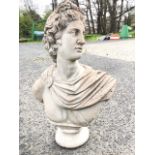 A composition stone roman style bust of a classical robed gentleman, after the antique. (20.75in)