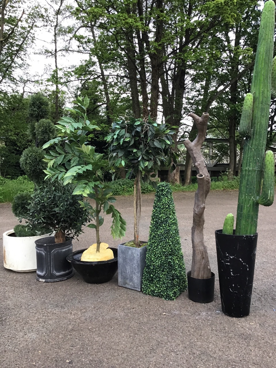 Seven artificial garden trees/shrubs with miscellaneous pots and tubs. (5)