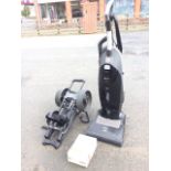 A Miele upright electric vacuum cleaner, power plus with automatic height adjustment and spare bags;