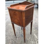 A nineteenth century mahogany pot cupboard, the top with upstand having ribbed edge, above a