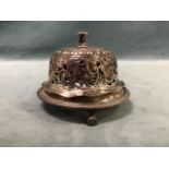 A Victorian pierced silver table bell, the domed cover on a circular gadrooned base raised on