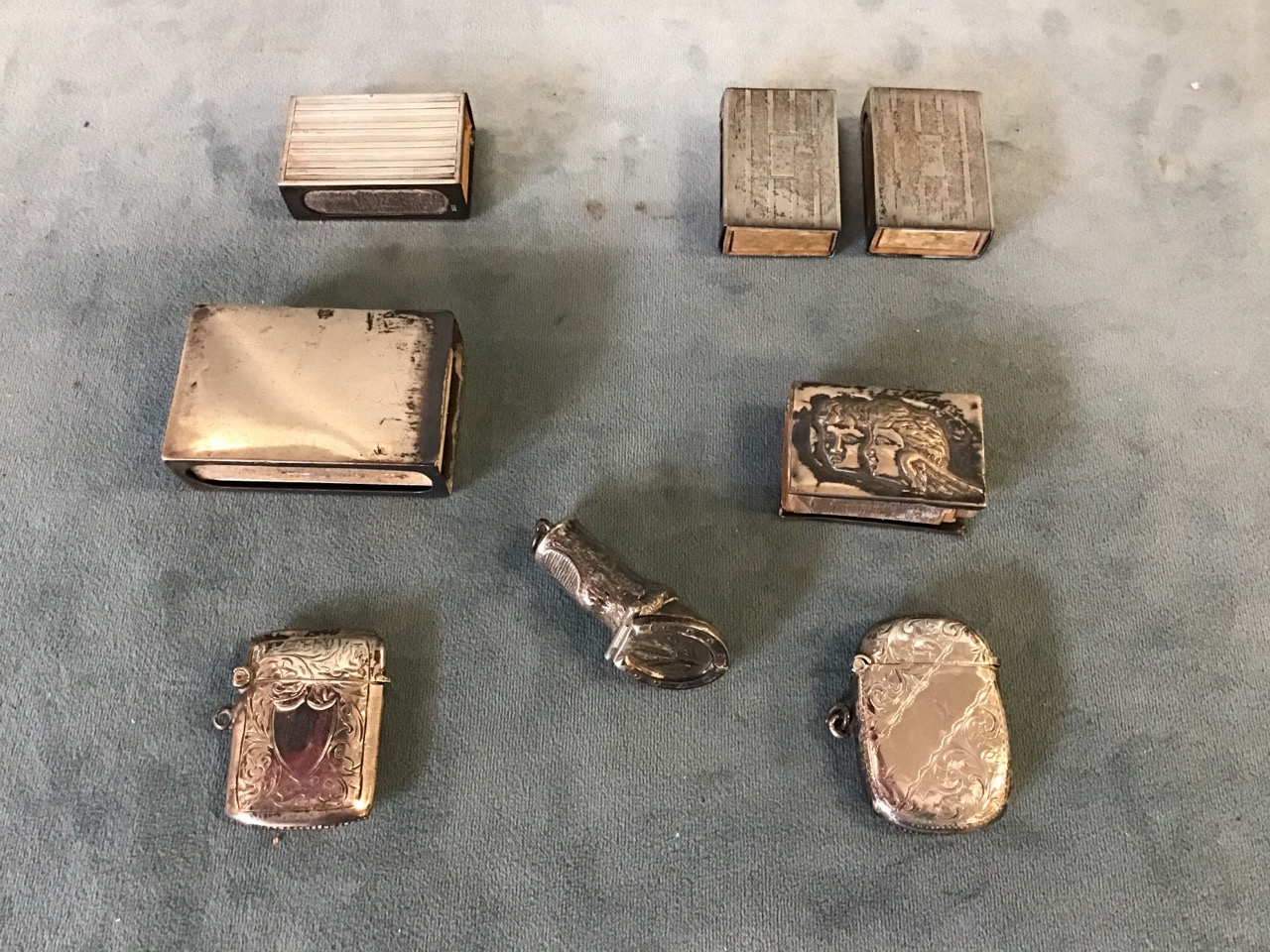 A collection of hallmarked silver matchbox holders and vesta cases including a pair marked Sterling;