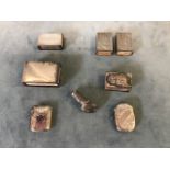 A collection of hallmarked silver matchbox holders and vesta cases including a pair marked Sterling;