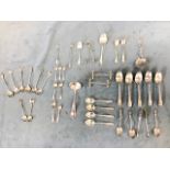 A collection of hallmarked silver flatware including various part sets of tea and coffee spoons,