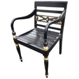 A painted regency style elbow chair, the bar-back above crossover rails centering on floral