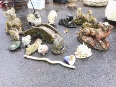 Miscellaneous garden ornaments - a pair of badgers, an eel, squirrel, sheep, a hedgehog, a shell,