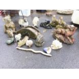 Miscellaneous garden ornaments - a pair of badgers, an eel, squirrel, sheep, a hedgehog, a shell,