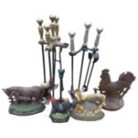 Two sets of firetools on stands; three cast iron animal flatbacks; and a cast iron cockerel doorstop