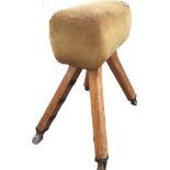 A vaulting horse with tubular leather padded seat on square rounded pitch pine adjustable legs,