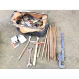 A bag of builders tools - wrenches, hammers, plumbers bends, spanners, set squares, chisels, etc. (A