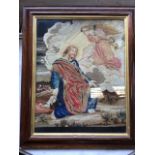 A Victorian rosewood framed woolwork tapestry with kneeling figure of Christ in Gethsemane before