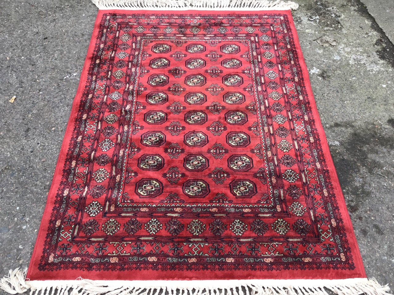 A bokarra rug woven with red field of octagonal lozenges and hooked battens within a wide border - Image 3 of 3