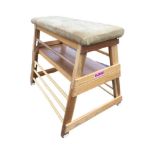 A 4ft hardwood gym horse with rectangular leather padded bench on triangular angled supports in