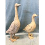 A painted carved wood duck - 17in; and a gilded metal long necked duck - 23in. (2)