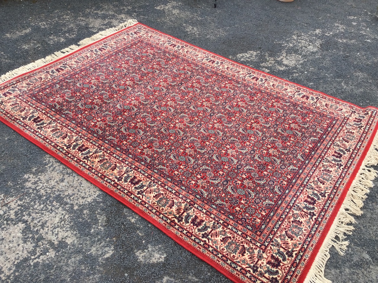 A Persian rug woven with field of busy paisley type floral decoration on red ground, within a frieze - Image 3 of 3