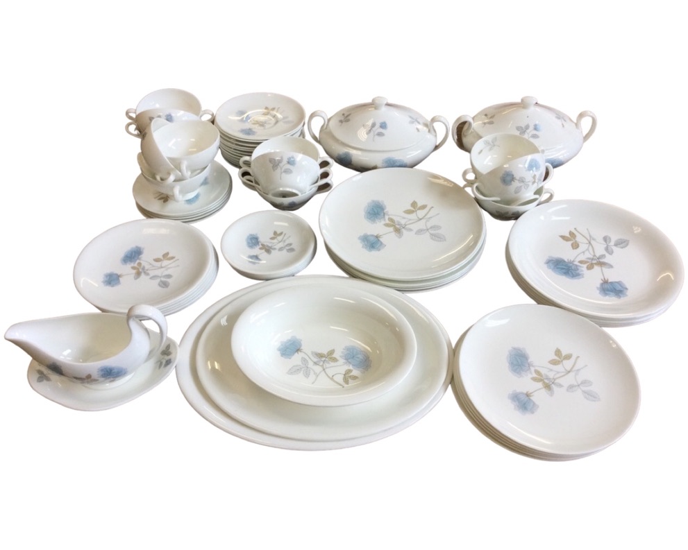 A C20th Wedgwood bone china dinner service with plates, a pair of tureens, soup cups, saucers, sauce