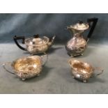 A Victorian four-piece hallmarked Victorian silver teaset with foliate scroll embossed decoration