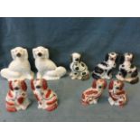 A quantity of Victorian Staffordshire dogs - two pairs of hand-painted in brick red with black