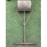 A garden roller with concrete drum on square iron supports with tubular handle. (21.5in x 56in)